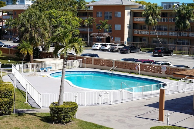 community pool with fence