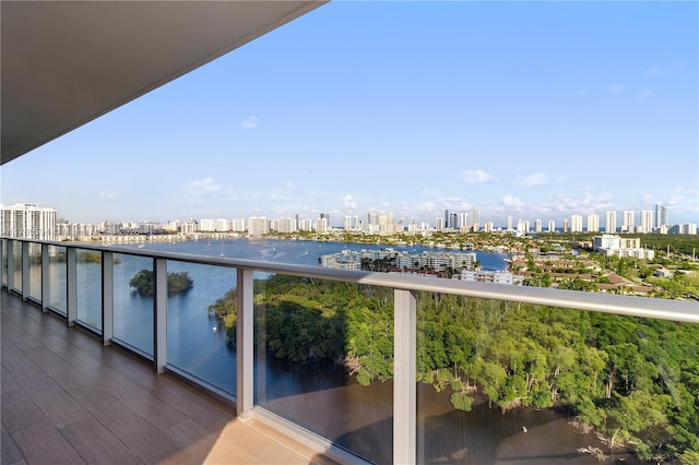 balcony with a view of city and a water view