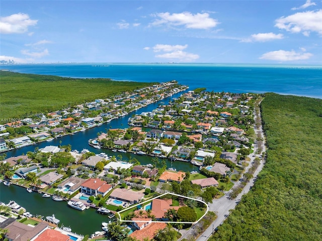 birds eye view of property featuring a residential view and a water view