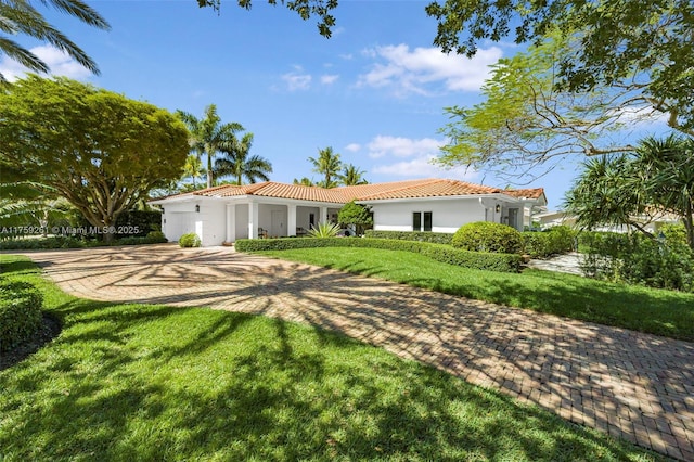 1117 Bella Vista Ave, Coral Gables, FL 33156 - ranch-style home featuring a tiled roof, a front lawn, and stucco siding