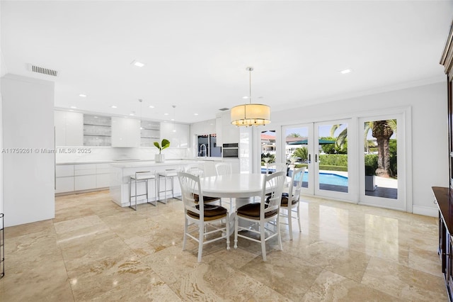 1117 Bella Vista Ave, Coral Gables, FL 33156 - living room with visible vents, crown molding, and baseboards