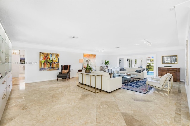 1117 Bella Vista Ave, Coral Gables, FL 33156 - living room featuring visible vents, baseboards, and ornamental molding