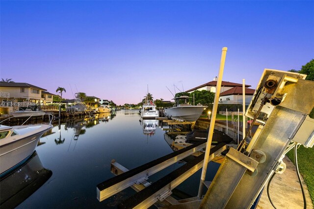 1117 Bella Vista Ave, Coral Gables, FL 33156 - view of dock with a residential view, boat lift, and a water view