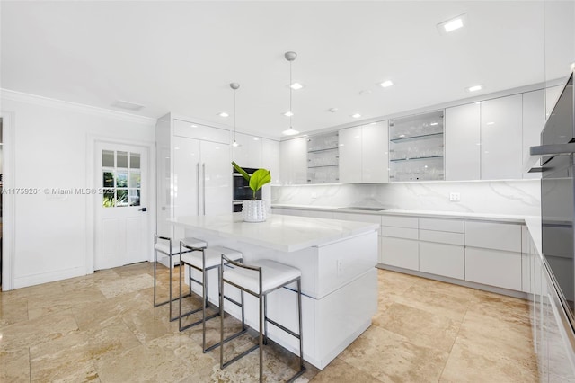 1117 Bella Vista Ave, Coral Gables, FL 33156 - kitchen with open shelves, modern cabinets, a kitchen breakfast bar, and white cabinets