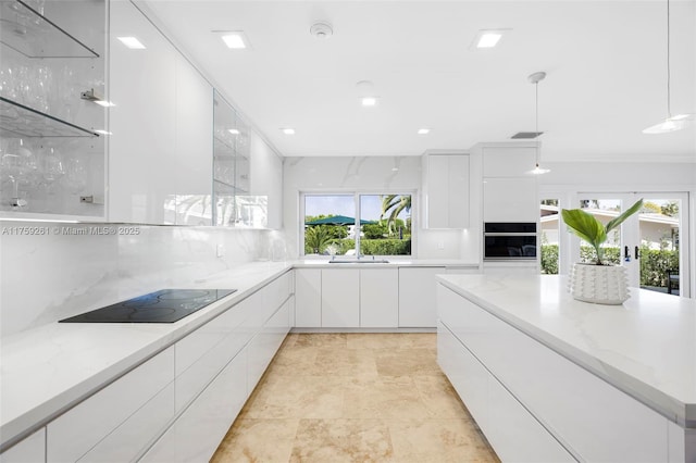 1117 Bella Vista Ave, Coral Gables, FL 33156 - kitchen with a sink, decorative backsplash, oven, modern cabinets, and white cabinets