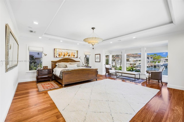 1117 Bella Vista Ave, Coral Gables, FL 33156 - bedroom with light wood-style flooring, visible vents, recessed lighting, and a tray ceiling