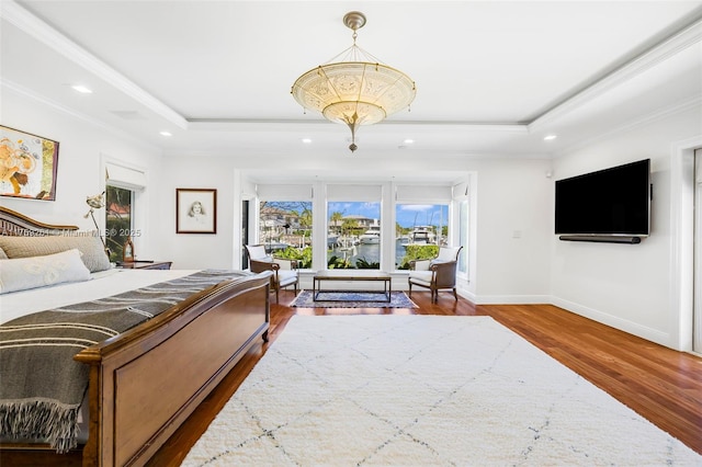 1117 Bella Vista Ave, Coral Gables, FL 33156 - bedroom featuring a tray ceiling, wood finished floors, ornamental molding, and recessed lighting
