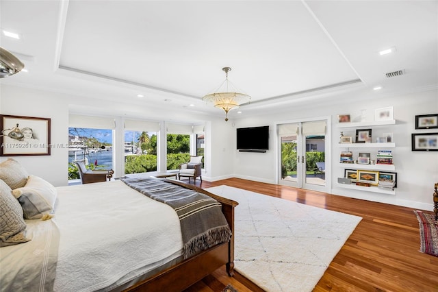 1117 Bella Vista Ave, Coral Gables, FL 33156 - bedroom featuring wood finished floors, a tray ceiling, access to exterior, visible vents, and recessed lighting