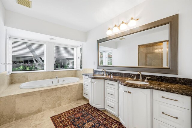 1117 Bella Vista Ave, Coral Gables, FL 33156 - full bath featuring double vanity, visible vents, a garden tub, and a sink