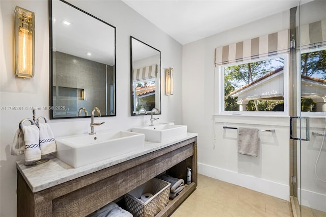 1117 Bella Vista Ave, Coral Gables, FL 33156 - full bathroom with double vanity, an enclosed shower, baseboards, and a sink