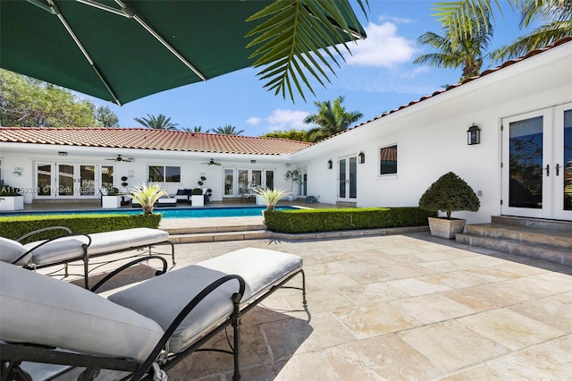 1117 Bella Vista Ave, Coral Gables, FL 33156 - view of patio featuring an outdoor pool, a ceiling fan, and french doors
