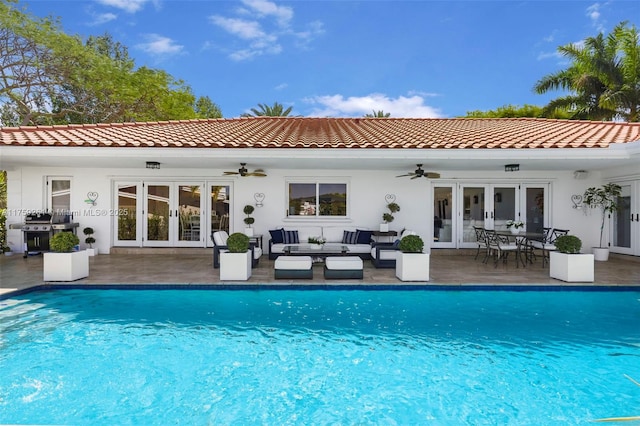 1117 Bella Vista Ave, Coral Gables, FL 33156 - back of property featuring an outdoor hangout area, a ceiling fan, and french doors