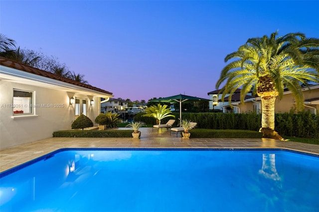 1117 Bella Vista Ave, Coral Gables, FL 33156 - pool at dusk featuring a fenced in pool