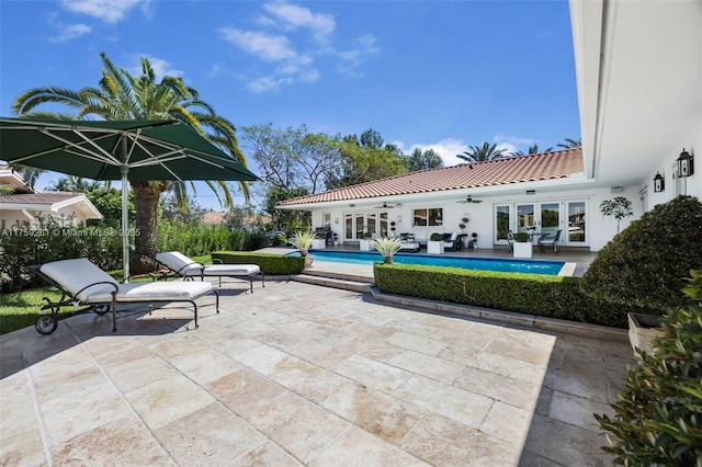1117 Bella Vista Ave, Coral Gables, FL 33156 - view of patio / terrace with an outdoor pool, ceiling fan, and french doors