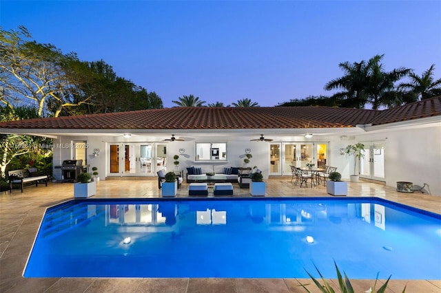 1117 Bella Vista Ave, Coral Gables, FL 33156 - outdoor pool with ceiling fan, a patio, an outdoor hangout area, and french doors