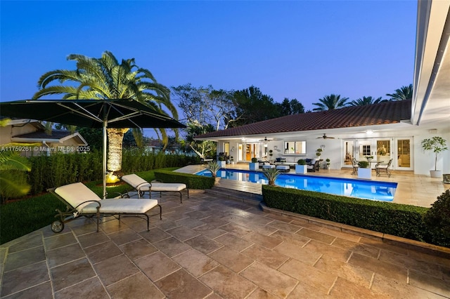 1117 Bella Vista Ave, Coral Gables, FL 33156 - outdoor pool with an outdoor hangout area, a ceiling fan, french doors, and a patio