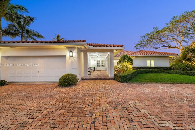 1117 Bella Vista Ave, Coral Gables, FL 33156 - mediterranean / spanish home with a tile roof, stucco siding, and decorative driveway