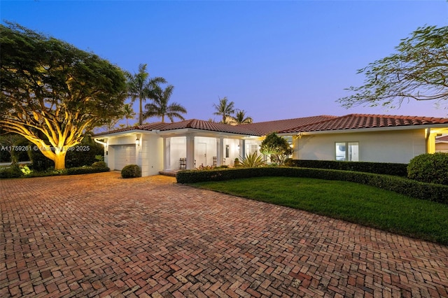 1117 Bella Vista Ave, Coral Gables, FL 33156 - ranch-style house with a yard, a tile roof, stucco siding, and decorative driveway