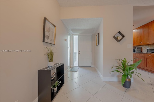 2888 S Carambola Cir S Unit 2079, Coconut Creek, FL 33066 - entrance foyer with light tile patterned floors and baseboards