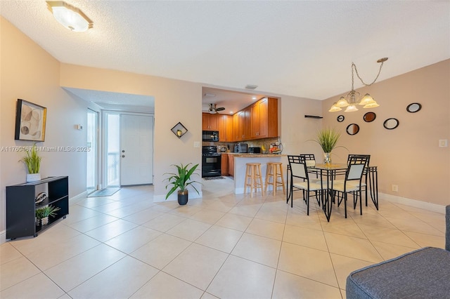2888 S Carambola Cir S Unit 2079, Coconut Creek, FL 33066 - dining room with a chandelier and light tile patterned floors