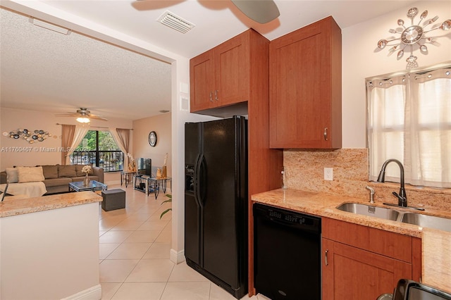 kitchen featuring visible vents, light tile patterned floors, black appliances, a ceiling fan, and a sink