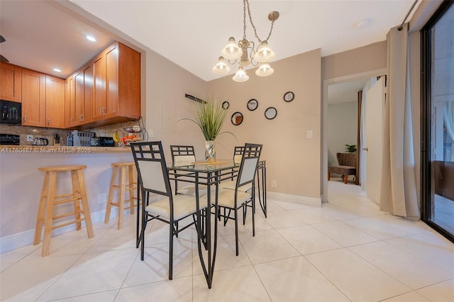 2888 S Carambola Cir S Unit 2079, Coconut Creek, FL 33066 - dining room featuring light tile patterned floors, a chandelier, and recessed lighting
