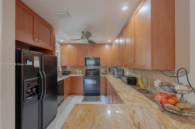 2888 S Carambola Cir S Unit 2079, Coconut Creek, FL 33066 - kitchen with black appliances, light tile patterned flooring, backsplash, a ceiling fan, and recessed lighting