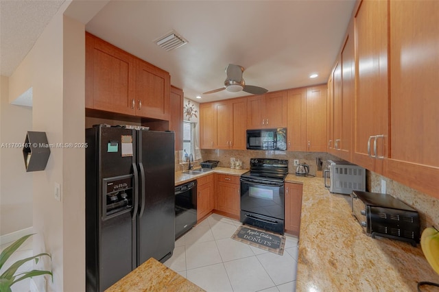 2888 S Carambola Cir S Unit 2079, Coconut Creek, FL 33066 - kitchen featuring black appliances, tasteful backsplash, ceiling fan, recessed lighting, and light tile patterned flooring