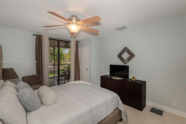 bedroom with access to exterior, visible vents, baseboards, light tile patterned floors, and a textured ceiling