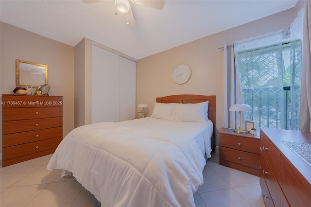 2888 S Carambola Cir S Unit 2079, Coconut Creek, FL 33066 - bedroom featuring light tile patterned floors, multiple windows, and a closet