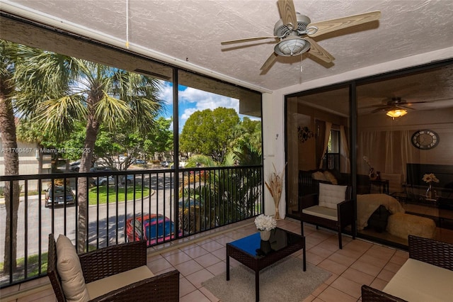 unfurnished sunroom with a ceiling fan