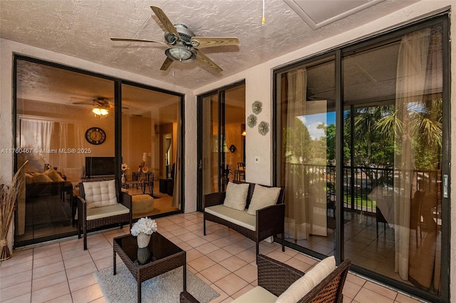 2888 S Carambola Cir S Unit 2079, Coconut Creek, FL 33066 - sunroom with a ceiling fan, tile patterned floors, and a textured ceiling