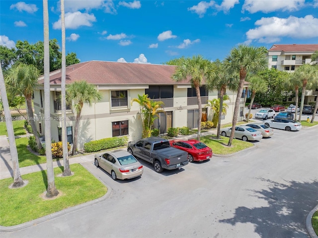 2888 S Carambola Cir S Unit 2079, Coconut Creek, FL 33066 - view of property featuring uncovered parking