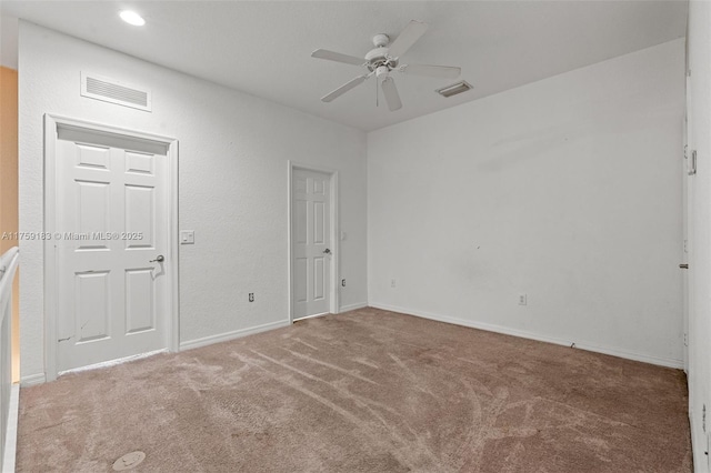 spare room featuring recessed lighting, visible vents, a ceiling fan, and carpet flooring