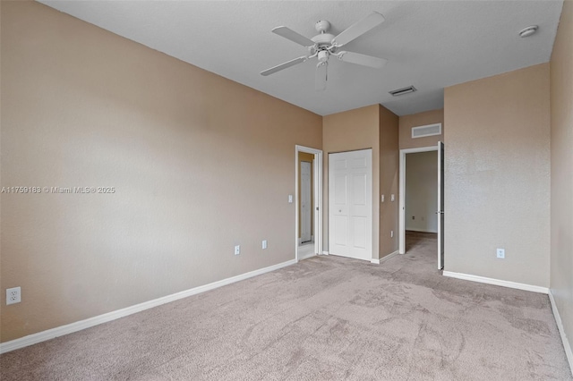 unfurnished bedroom featuring visible vents, baseboards, and carpet floors