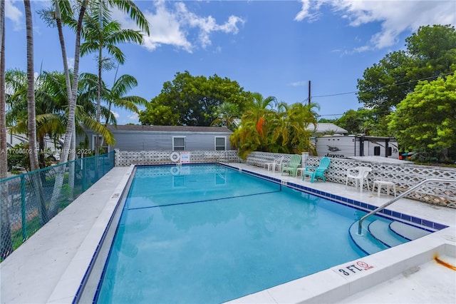 community pool featuring fence