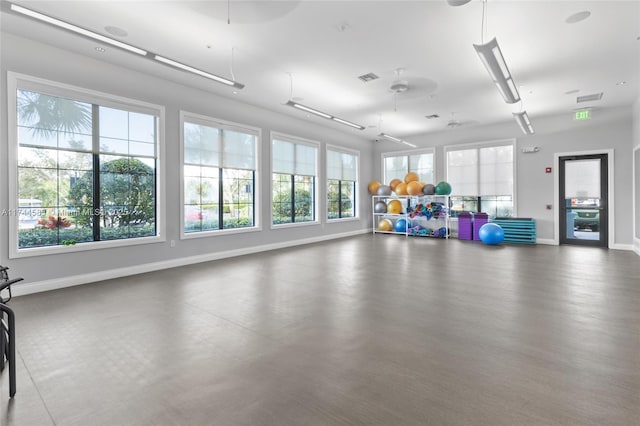 workout area featuring baseboards and visible vents