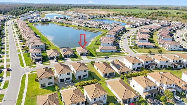 birds eye view of property featuring a residential view and a water view