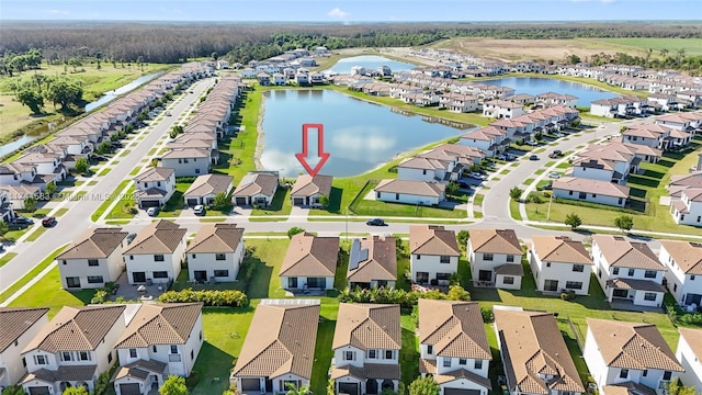 aerial view with a residential view and a water view