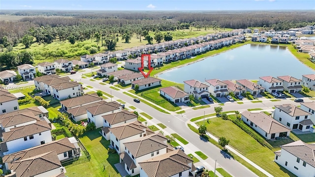 bird's eye view with a residential view and a water view