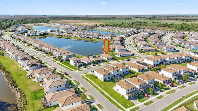 bird's eye view with a residential view and a water view