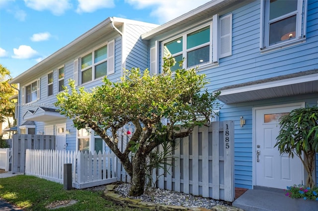 view of front of home with fence