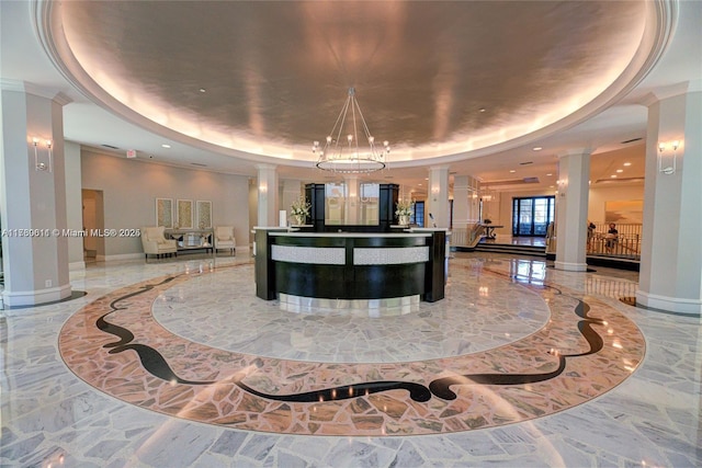 reception featuring a notable chandelier and ornate columns