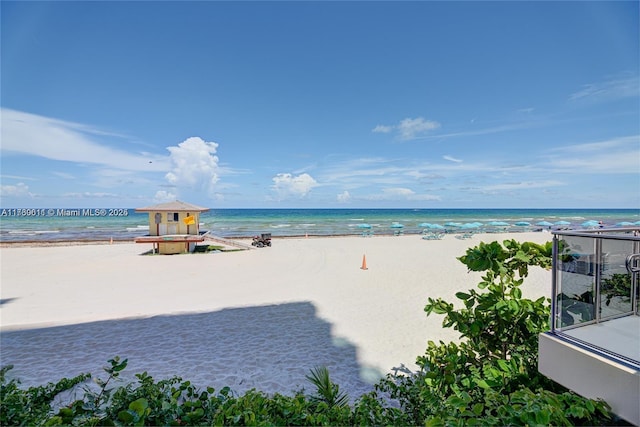 property view of water featuring a beach view