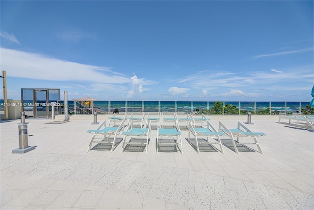 view of pool with a water view