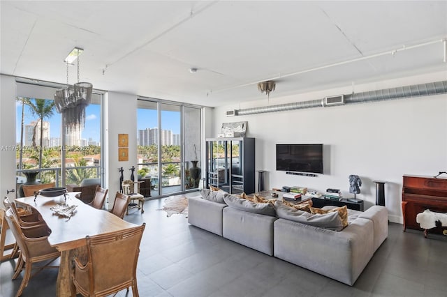 living room with visible vents and floor to ceiling windows