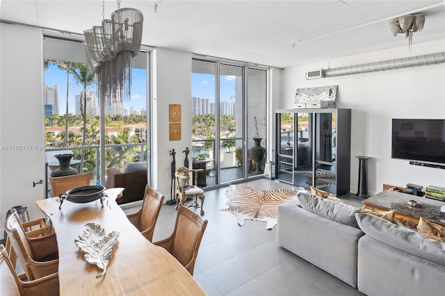 living area with tile patterned floors, visible vents, and floor to ceiling windows