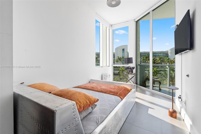 bedroom featuring a wall of windows