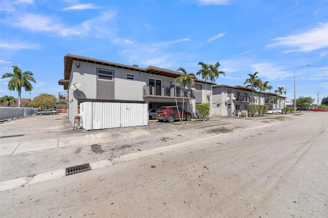 view of property featuring uncovered parking