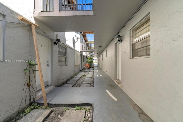 view of patio featuring a balcony